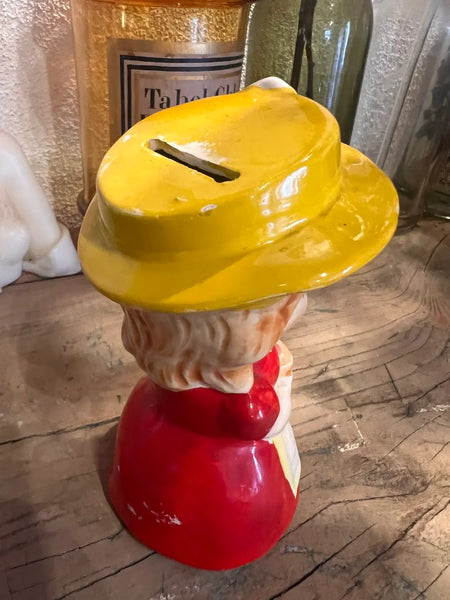 Tirelire vintage en faïence jeune fille au chapeau jaune