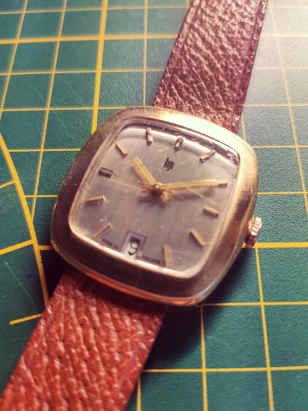 Montre Lip mécanique avec dateur - Années 70 - Le Sélectionneur - Brocante en ligne
