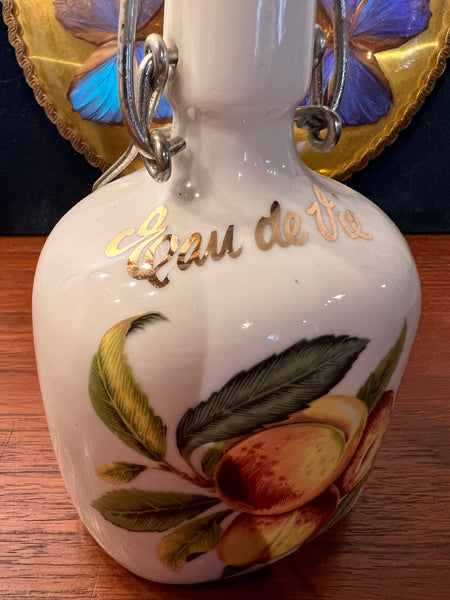 Bouteille vintage à eau de vie Mirabelle en porcelaine